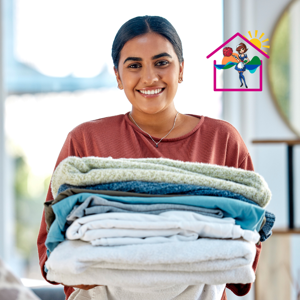 Professional Airbnb cleaner with folded fresh linen in Sunshine Coast holiday rental – The Maids cleaning service